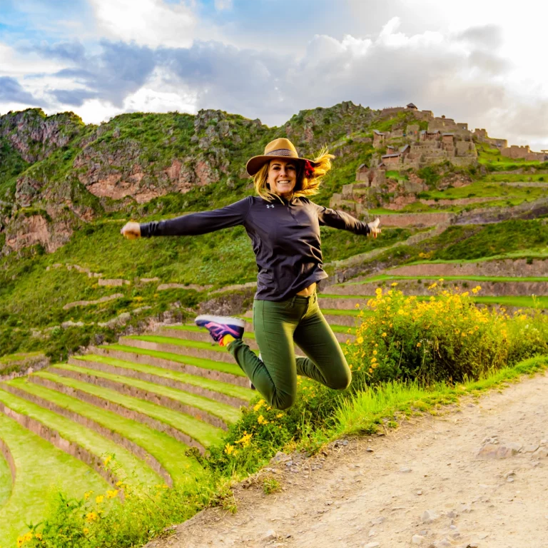 Traveler Jumping in Sacred Valley with Andeana Hat Peru square